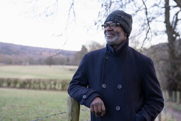 Senior man posing in rural setting