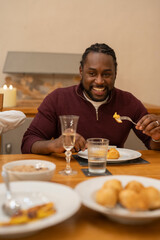Man eating dinner at home