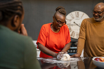 Family baking together in kitchen