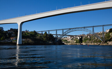 View from the Douro River of the Sao Joao Bridge, the Dona Maria Pita Bridge and the Infante Dom Henrique Bridge in O Porto