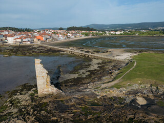 Fototapeta na wymiar Aerial view of the San Sadurniño Tower and the San Tomé neighborhood and the San Sadurniño bridge in Cambados, Pontevedra