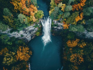 Fototapeta na wymiar Top-down view of a waterfall cascading down into a pool below