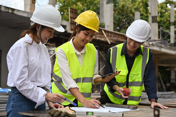 Civil engineers, architects, and contractors discussion to plan building construction