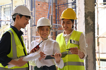 Construction team planing work procedure on construction site