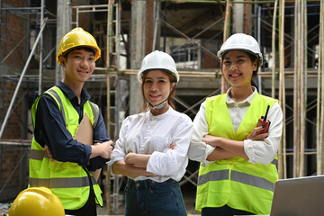 Portrait confident manager, engineer, and worker on the construction site