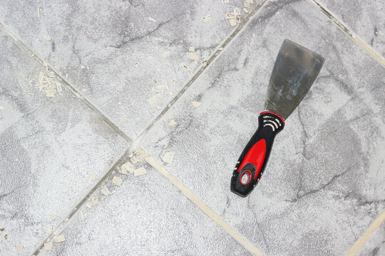 Restoration of inter-tile seams on the floor