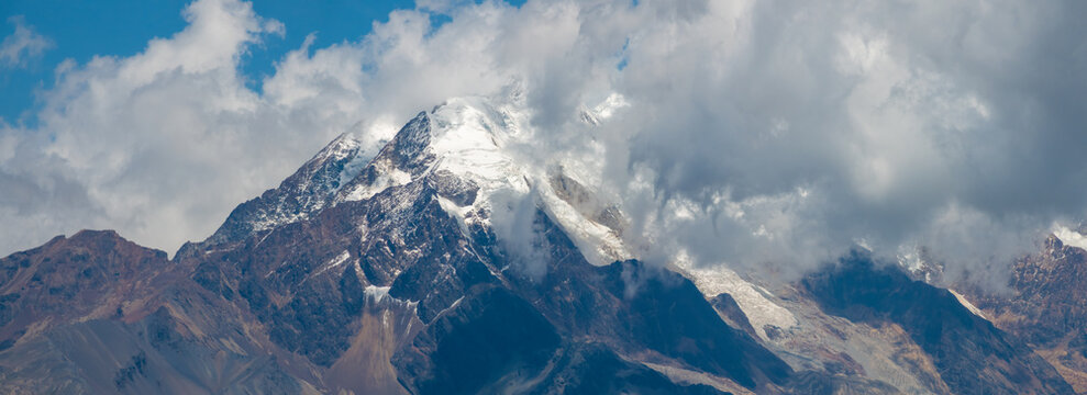 Illimani, the highest mountain in the Cordillera Real, near the cities of El Alto and La Paz at the eastern edge of the Bolivian Altiplano.