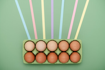 Green carton of eggs with leading lines. Geometric Easter background
