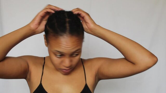 Black woman with her natural 4c hair on a white background