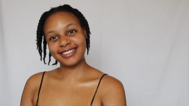 Black woman with twists on her natural 4c hair on a white background