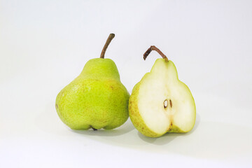A delicious Pear isolated. One whole green pear and a half of fruit on white background. Pear slice. With clipping path. Full depth of field.
