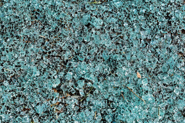 Car windshield glass fragments on floor