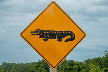 Caiman crossing road sign in Pampas region of Rurrenabaque on the Beni river, Beni Department,...