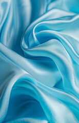 extreme close-up of a silk fabric folds in pastel blue color