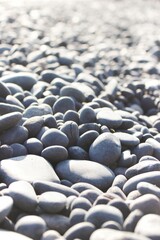 Fototapeta na wymiar Close-up view of the multiple pebbles at a rocky beach