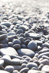Obraz premium Close-up view of the multiple pebbles at a rocky beach