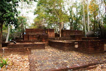 Ancient ruins ubosot ordination hall and antique old ruin tempel for thai people traveler travel visit and respect praying holy myth mystical in Wat Phu Chuang at Ban Rai city in Uthai Thani, Thailand