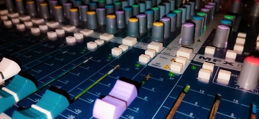 Closeup shot of an audio mixer.