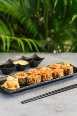 Baked rolls with cheese served with wasabi, pickled ginger, soy sauce and mayonnaise