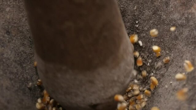 Rustic wooden pilon, handmade, used to grind corn in the traditional way in the fields of Latin America