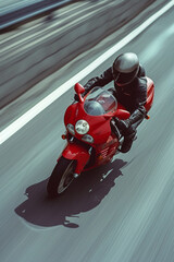 Obraz premium A man is riding a red motorcycle in an inland area that has good road quality.