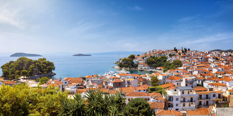 Panoramic summer day view over the town of Skiathos island with the traditional, red roofed houses, Sporades, Greece