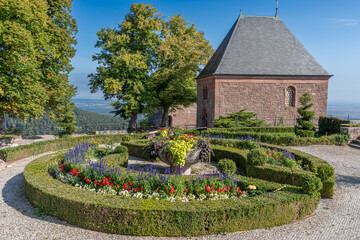 Mont Sainte Odile, France - 09 11 2020: Alsatian Vineyard. Panoramic view of the courtyard and a chapel of the Sanctuary of Mont Sainte Odile along the wine route at sunrise.