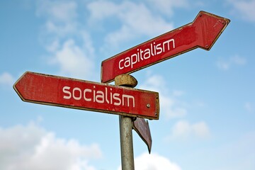 concept of socialism and capitalism, signs that mark different direction