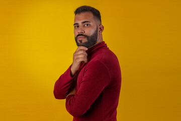 Adult man with beard wearing red long-sleeved shirt