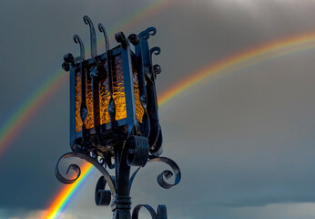 Street lantern and rainbow on the sky - 731885669