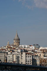 Fototapeta na wymiar Galata Tower standing tall above Istanbul's cityscape on a sunny day.