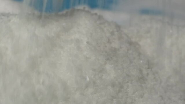 A macro view of salt crystals accumulating, a stark reminder of dietary moderation and the impact of too much sodium.