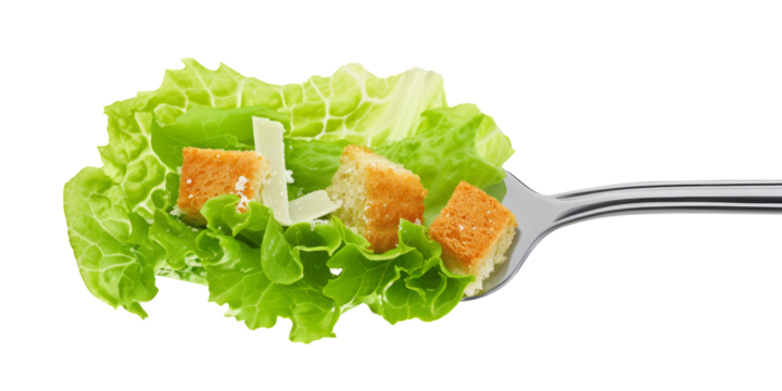 forkful of Caesar salad with crisp romaine lettuce, croutons and parmesan shavings.