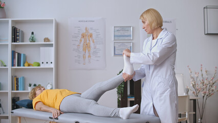 A doctor evaluates a patient suffering from joint inflammation, providing arthritis treatment