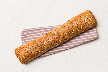 fresh crunchy french baguette on colored table. Top view Bakery products