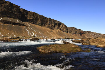 Fototapeta na wymiar View on a waterfall in the Suðurland region of Iceland