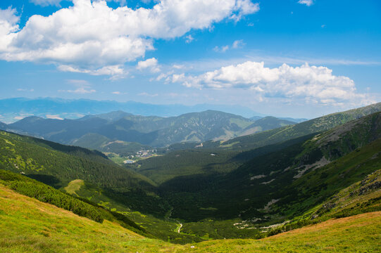 View of ski village Jasna in Low Tatras (N&iacute;zke Tatry, Dem&auml;novsk&aacute; Dolina) National Park in central Slovakia. Hiking along a mountain ridge in clear weather.