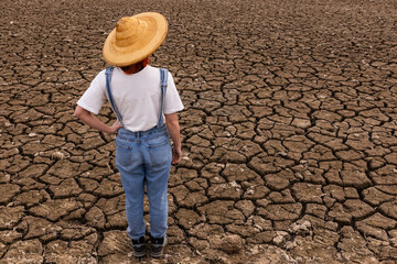 People in middle of dry field, weather problems, drought