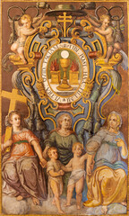 VALENCIA, SPAIN - FEBRUARY 15, 2022:  The fresco of blazon with eucharist symbolic and saints in the church Iglesia del Patriarca by unknown artist. 