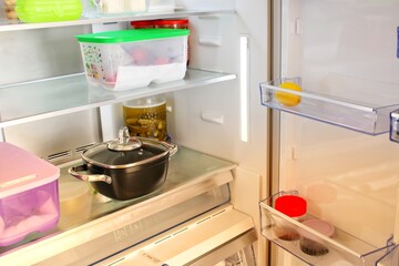 Empty refrigerator. Concept of poverty idea, food crisis, gluten allergy and celiac disease. Drought, famine and epidemic concept