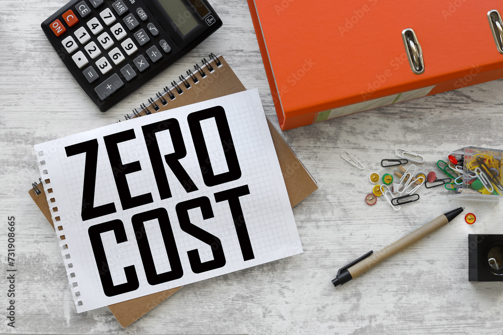 Poster zero cost. notepad page with text. on a yellow notepad