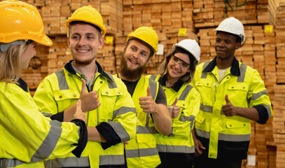 Portrait group of diversity wood factory worker men and women making thumbs up and working in wood...