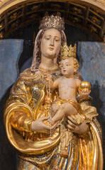 BELLANO, ITALY - JULY 20, 2022: The detail of carved polychrome statue of Madonna in the church Chiesa dei santi Nazareo e Celso by unknown artist of 16. cent.
