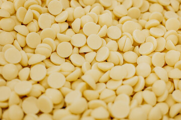White chocolate small peaces close up photo