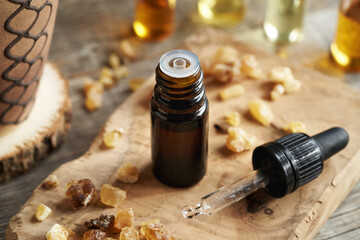 A dark bottle of frankincense essential oil with boswellia resin