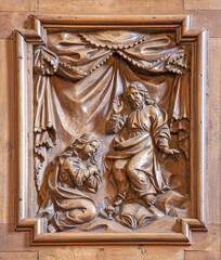VARENNA, ITALY - JULY 20, 2022: The carved Annunciation in the church Chiesa di San Giorgio by unknown baroque artist. - 731933293