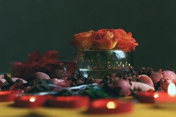 Bouquet of roses, candles and gifts, card for February 14, St. Valentine, March 8, wedding, birthday, mother's day, blurred background, bokeh.