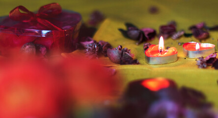 Bouquet of roses, candles and gifts, card for February 14, St. Valentine, March 8, wedding, birthday, mother's day, blurred background, bokeh.