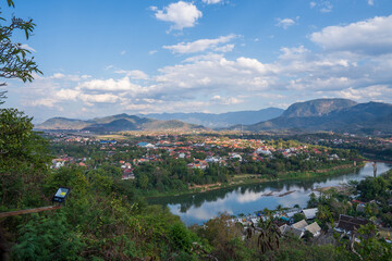 Fototapeta na wymiar View of the countryside and the city of Luang Prabang from the top of Mount Phousi in Laos, Southeast Asia.
