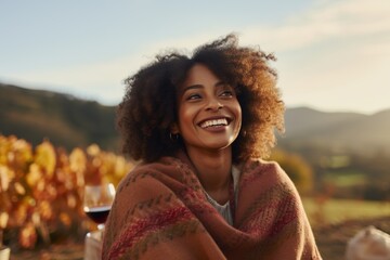 Portrait of a smiling young woman on a picnic - Powered by Adobe